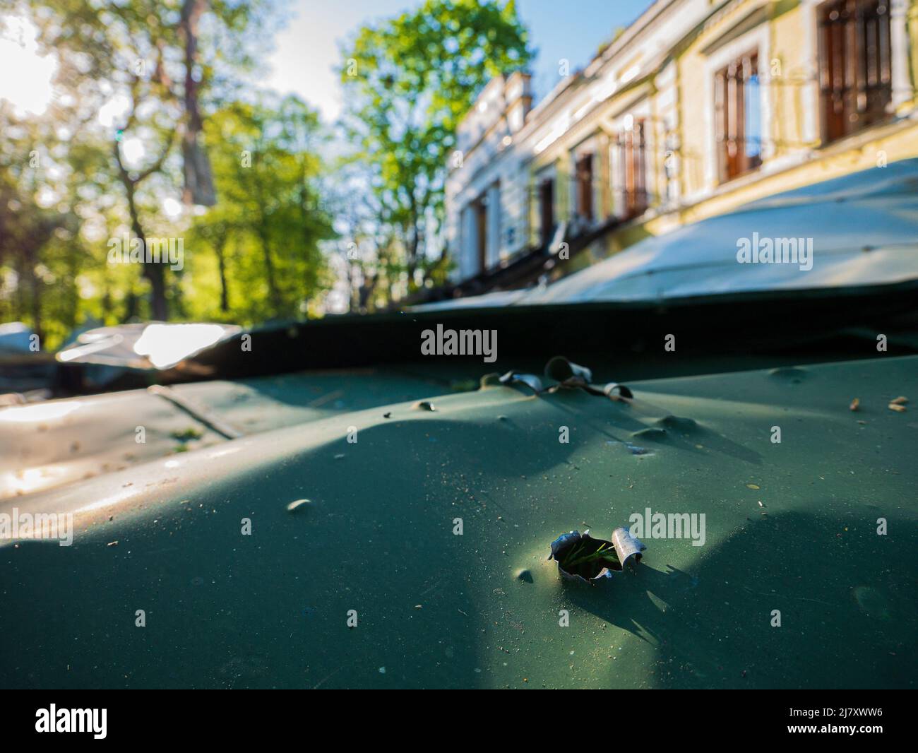 Kharkiv, Kharkov region, Skovorodinovka, Skovorodinivka, Ukraine - 05.07.2022: piece of metal fragments from building bullet hole after shelling Stock Photo