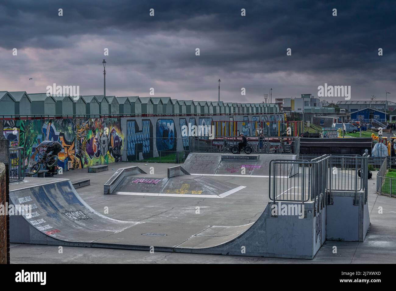 The skate park at The Big Beach Cafe owned by fat Boy Slim (Norman Cook) at Hove Lagoon on Hove seafront with the beach huts and street art Stock Photo