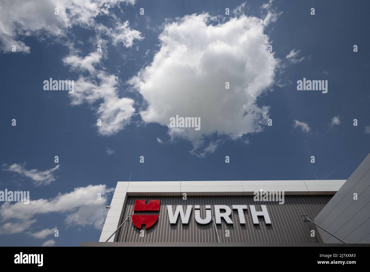 Kupferzell, Germany. 11th May, 2022. The logo of the Würth trading group  can be seen on the facade of a logistics center. Formerly specialized in  screws, Würth now also offers tools, electronic