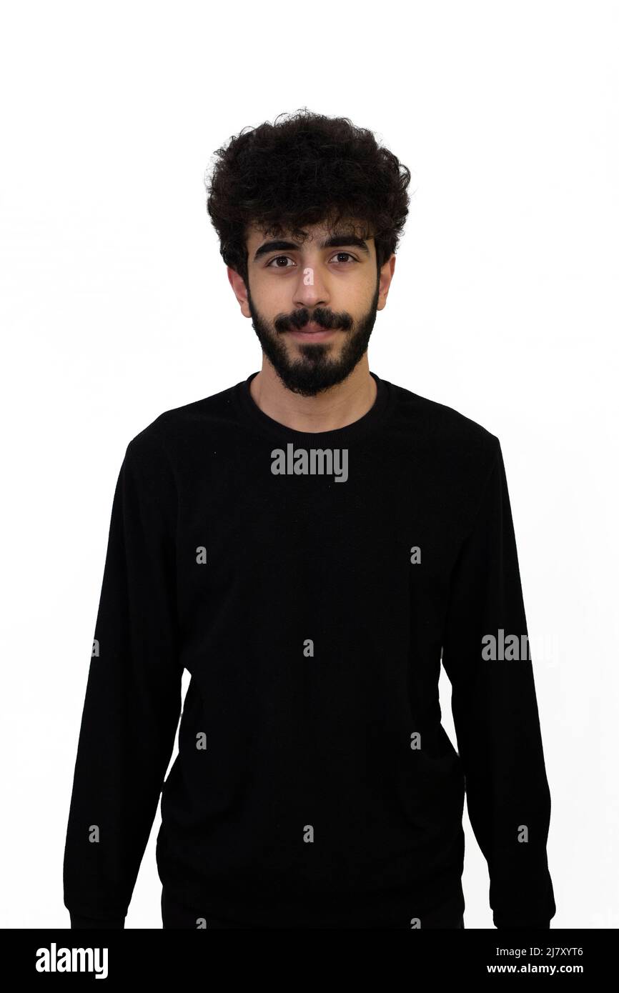 Curly haired young male in black sweater. Isolated on white background Stock Photo