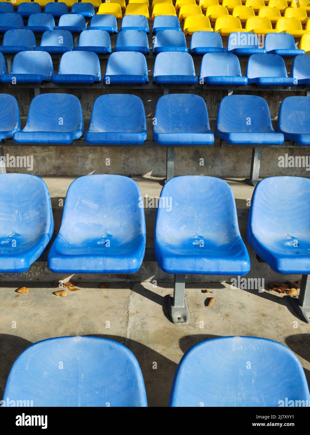 Empty plastic chairs at the stadium. Stock Photo