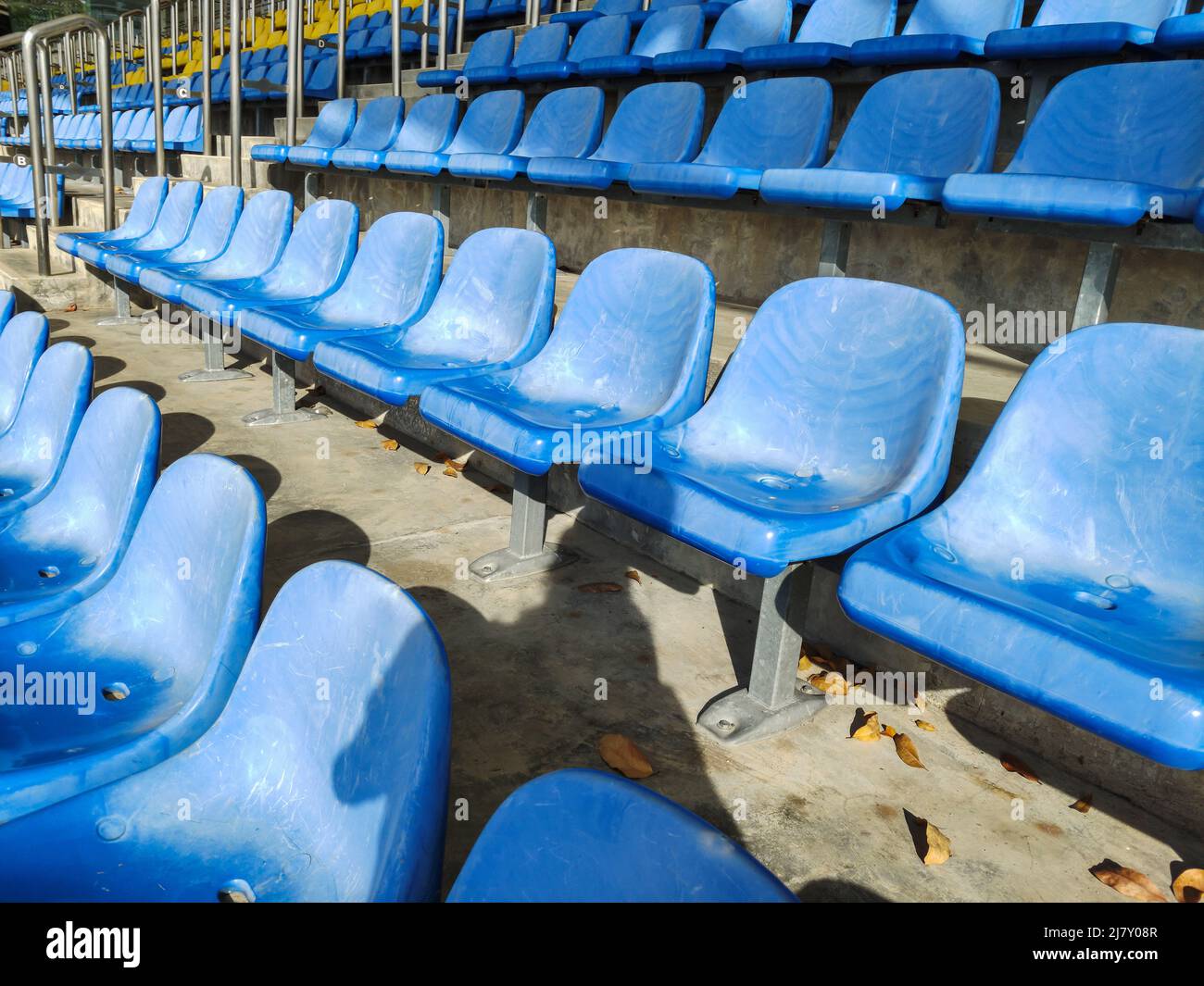 Empty plastic chairs at the stadium. Stock Photo