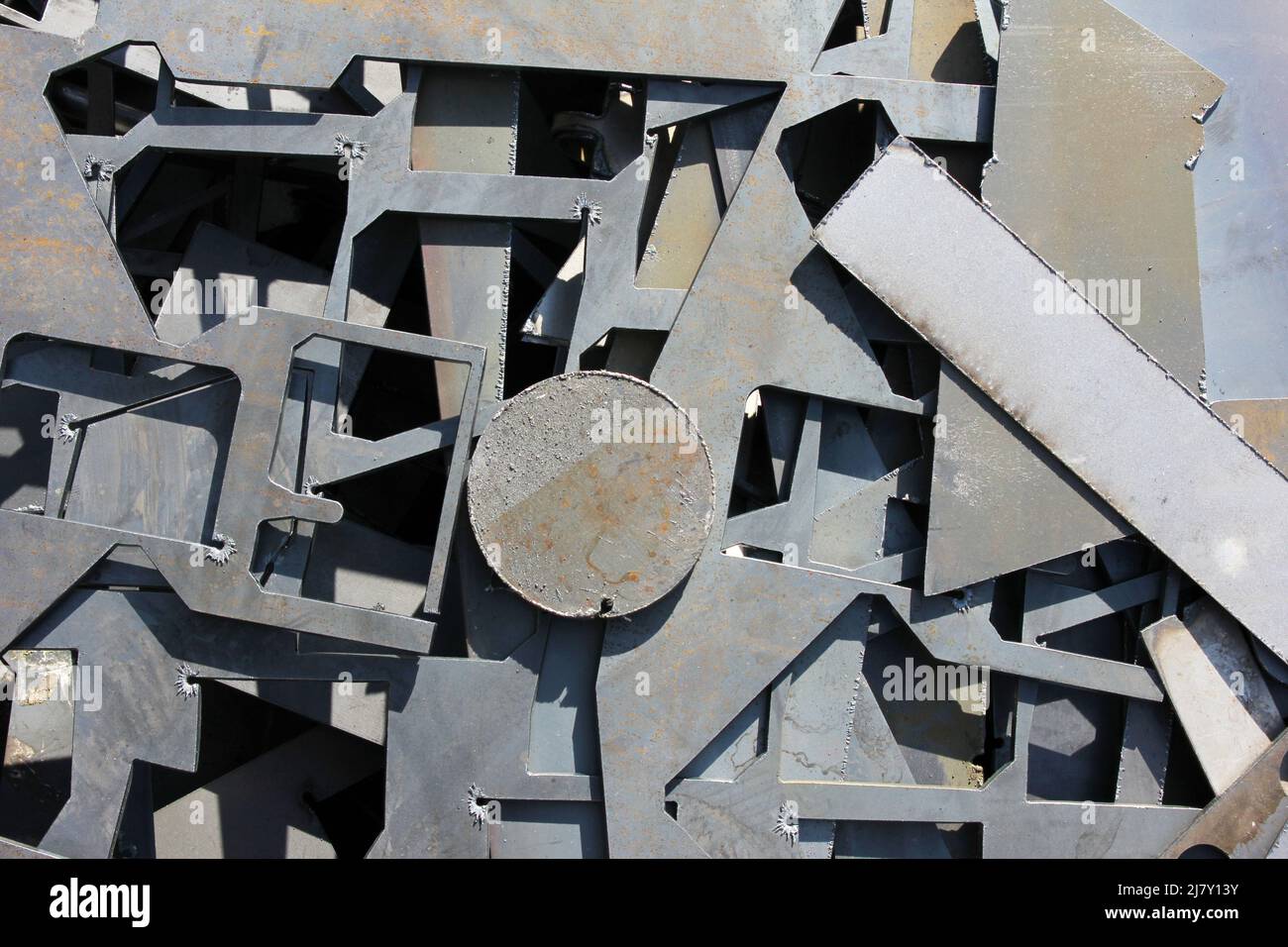 Scrap metal. metal residues after laser cutting Stock Photo Alamy