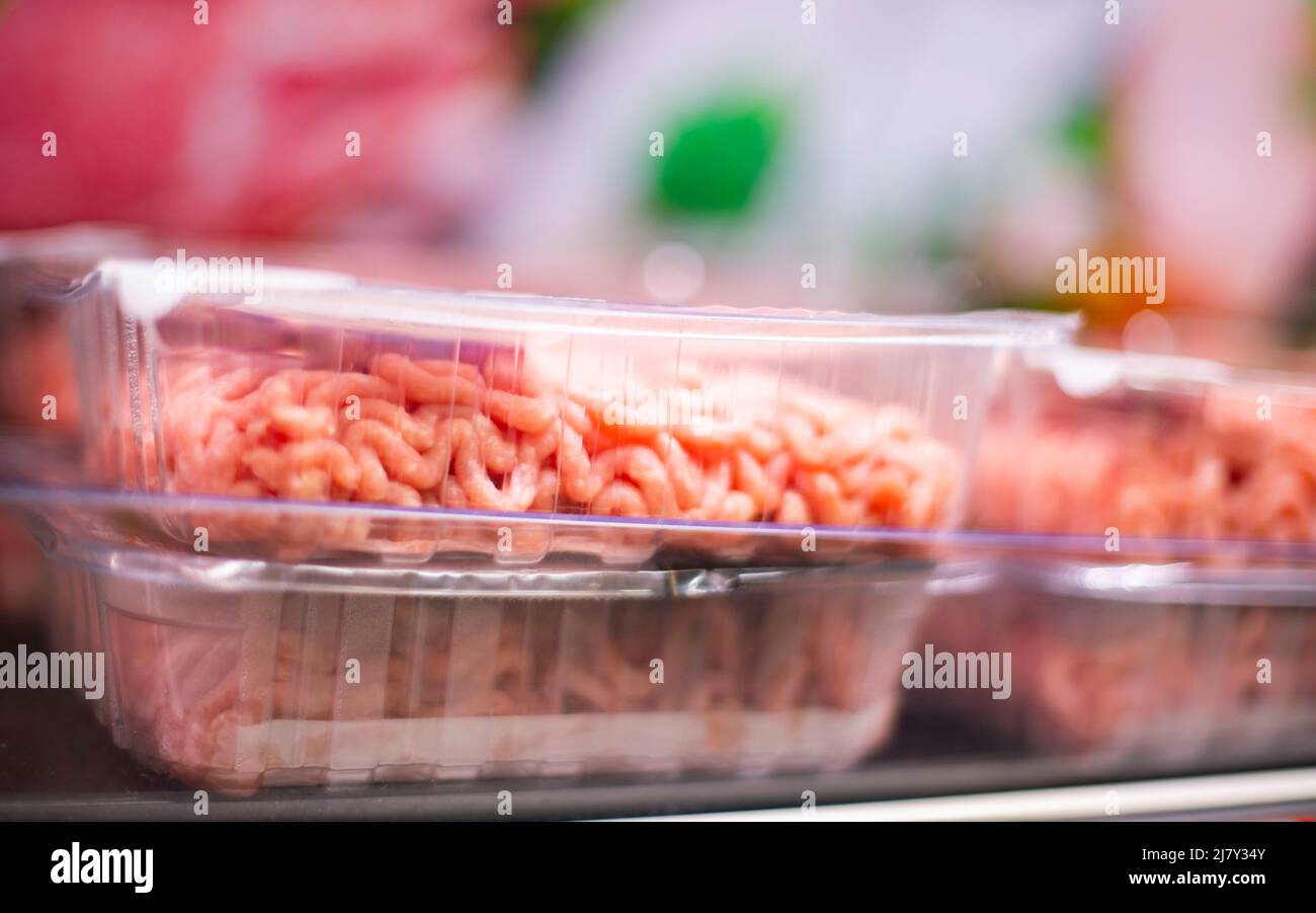 Meat products put up for sale in a supermarket commercial refrigerator Stock Photo
