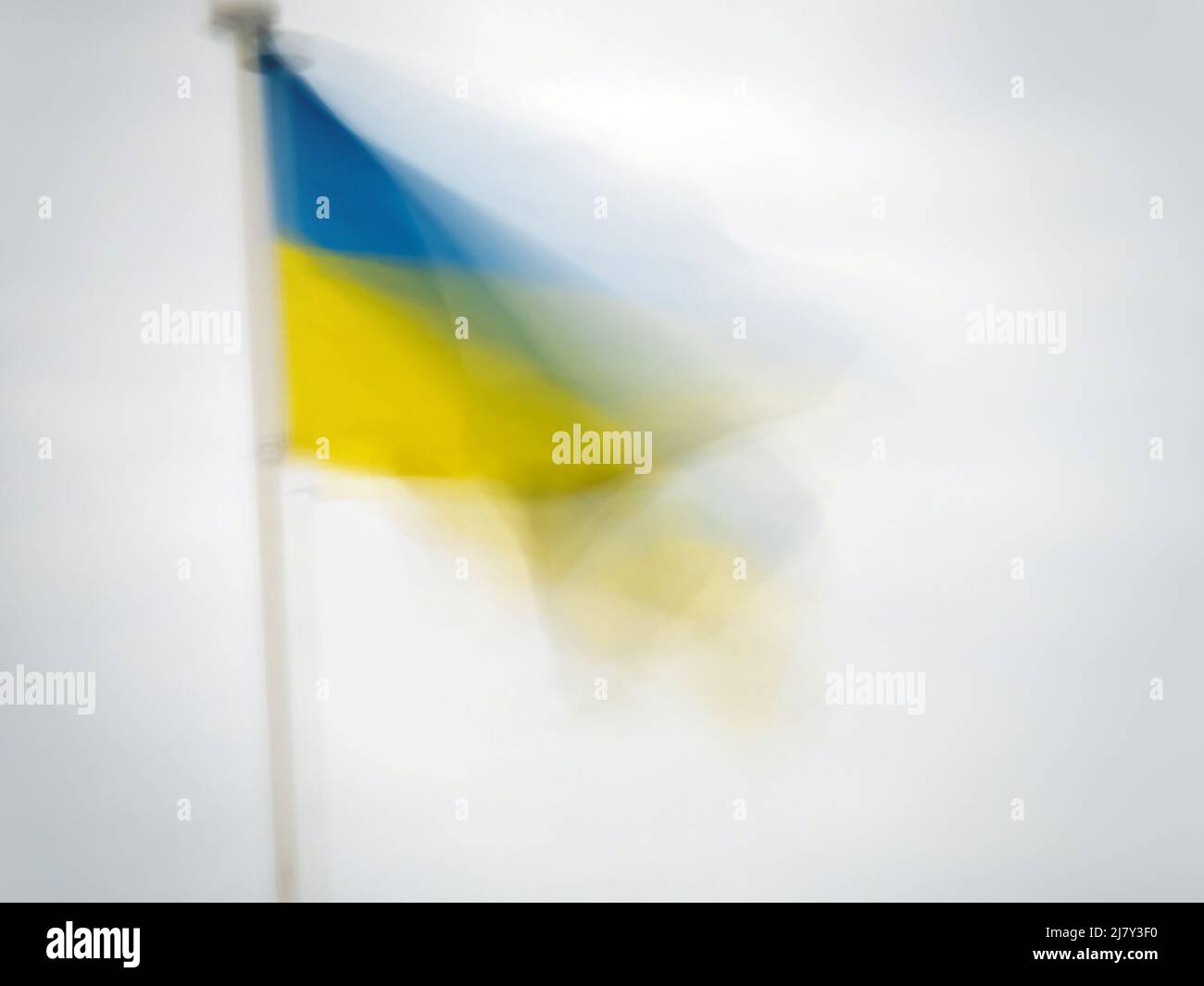 Ukraine national flag blowing in the wind. Impressionist effect with copyspace. Stock Photo
