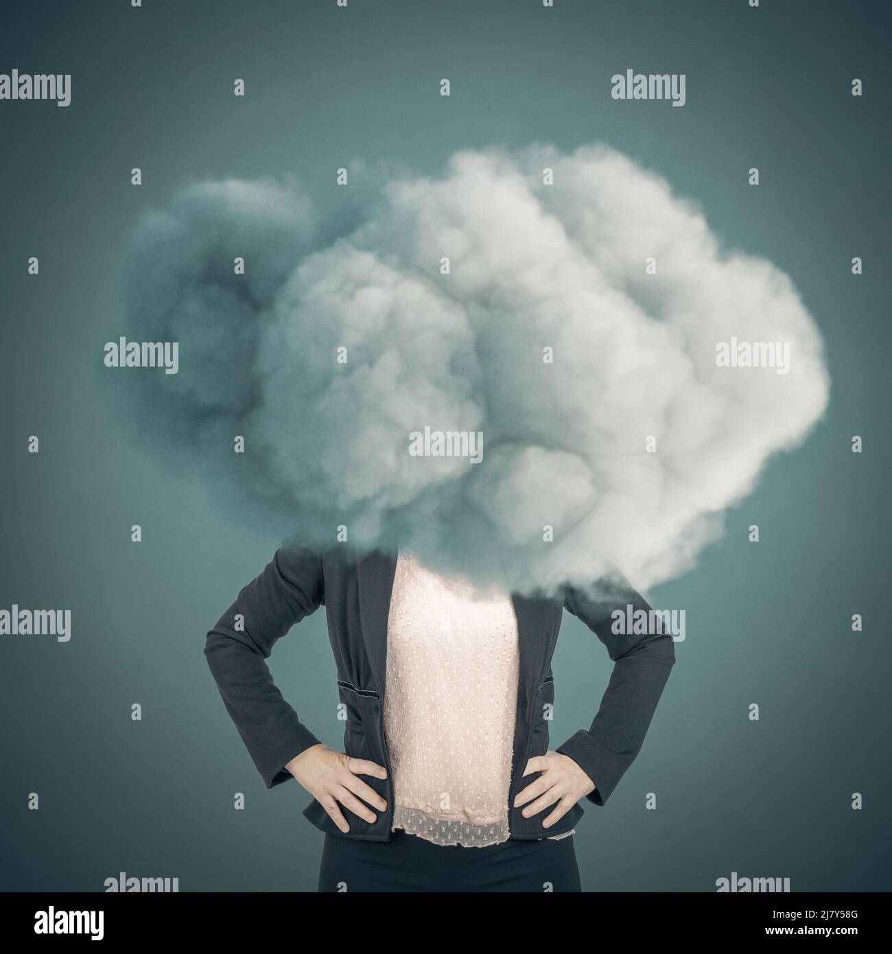 businesswoman with head in the clouds Stock Photo