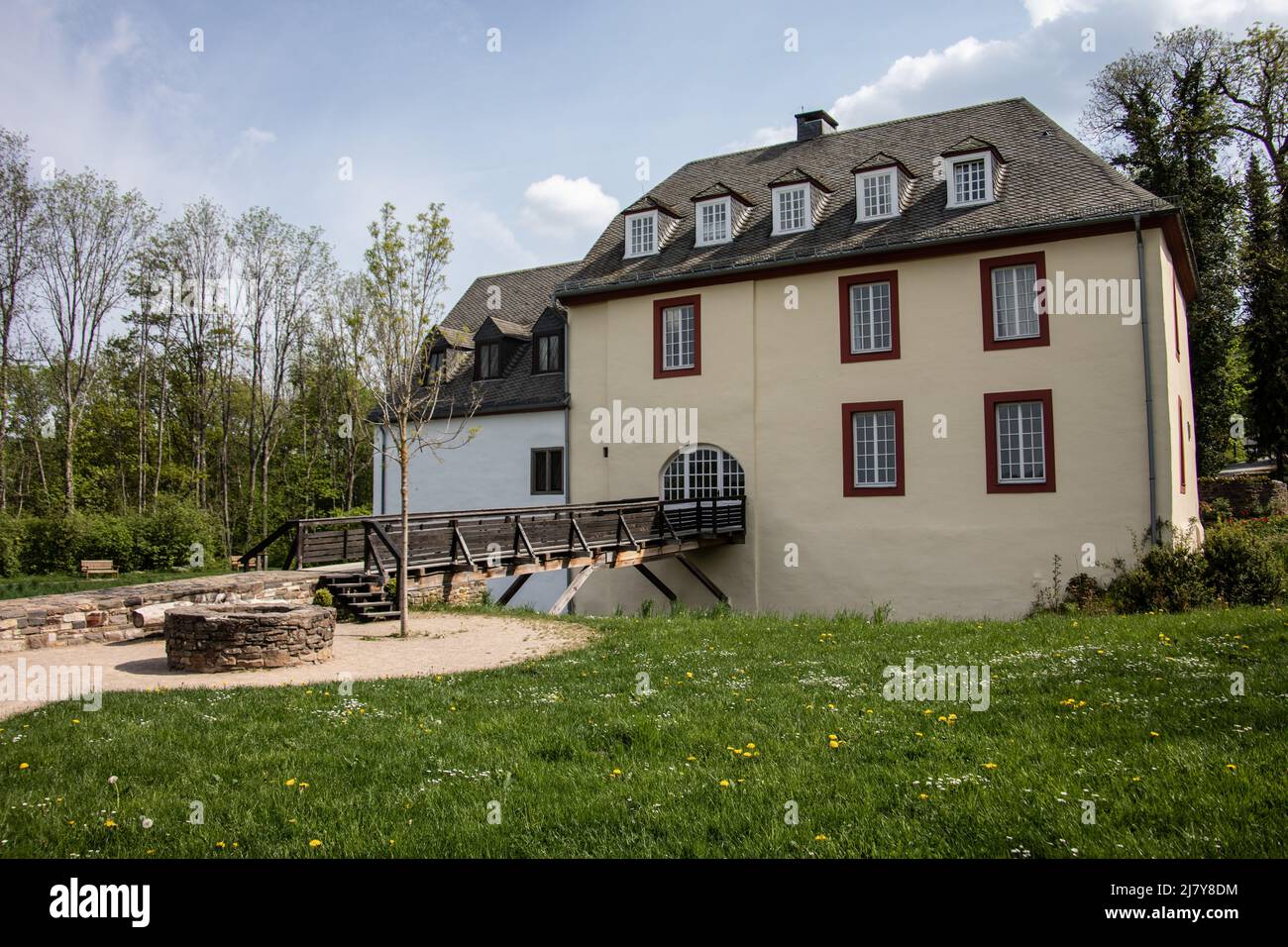 Moated castle with a moat in the countryside near Netphen Stock Photo
