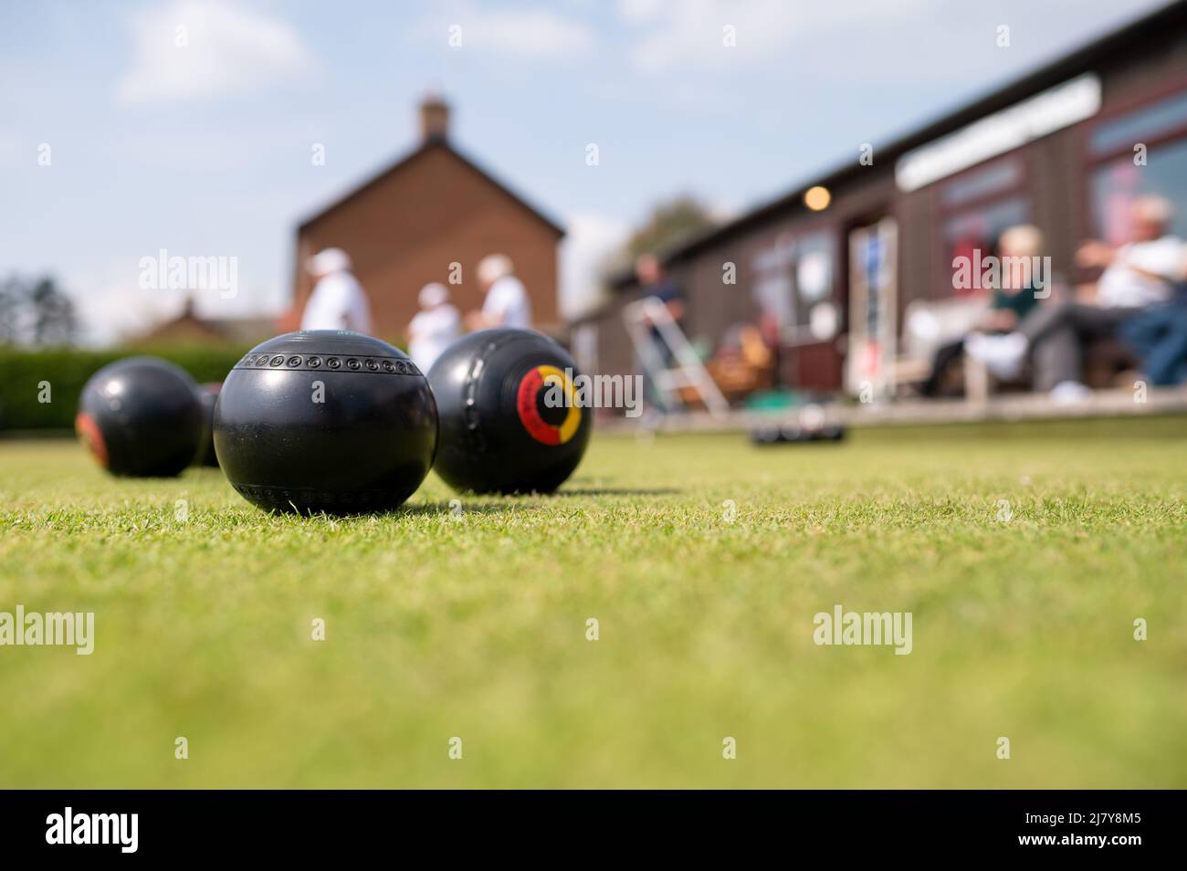 Bowls on green close up low angle british summer sport Stock Photo