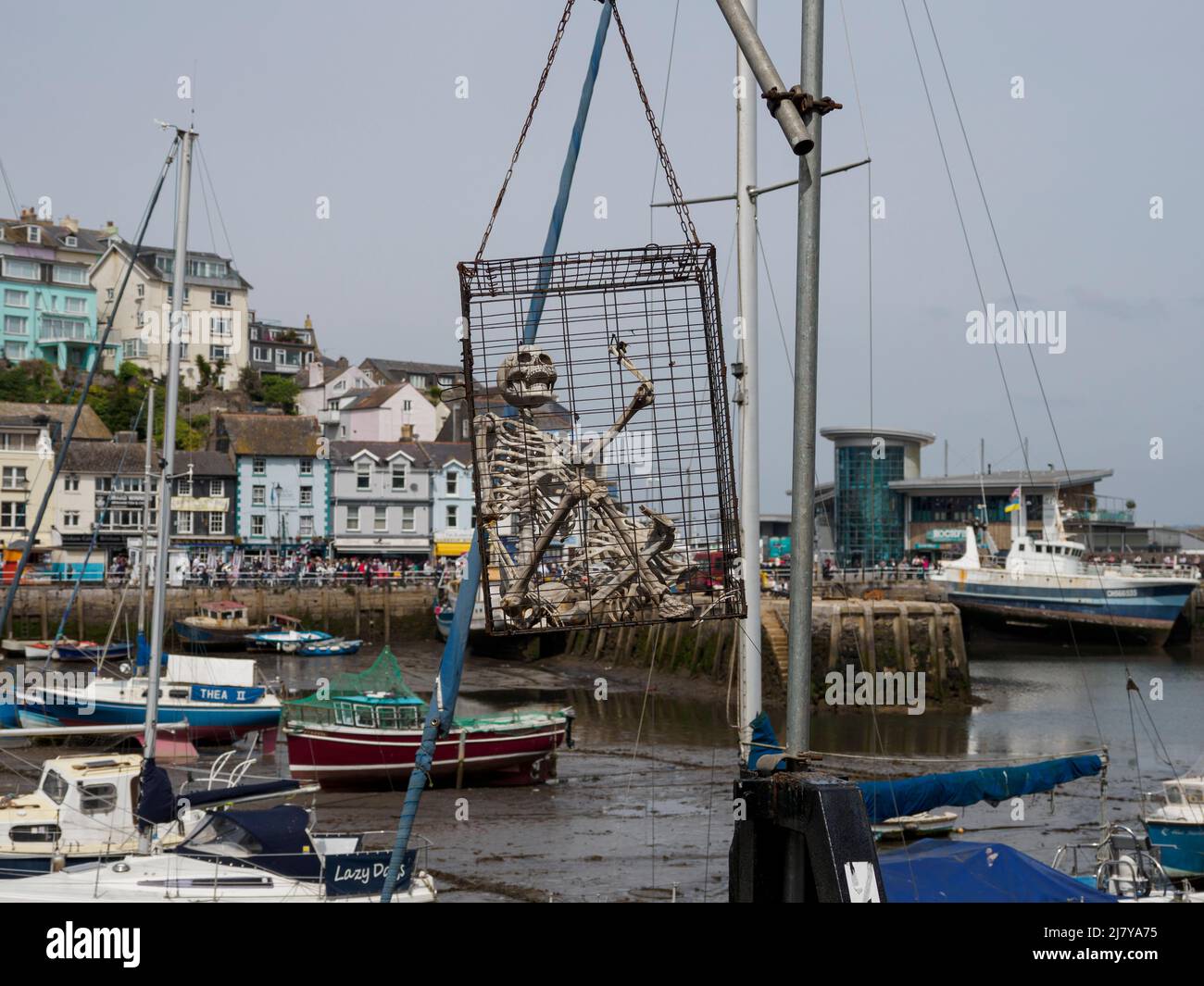Skeleton in a cage hanging over the harbour at the Brixham Pirate Festival 2022, Devon, UK Stock Photo