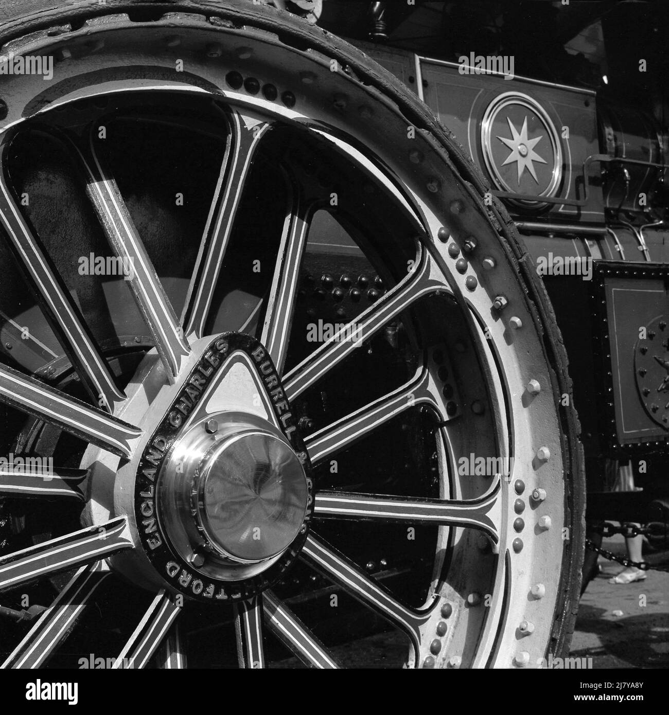 1969, historical, a close-up of a wheel on a steam tractor engine, made by Charles Burrell & Sons, whose name is seen on the wheel's hub.  Founded in 1770, they were famous builders of steam tracton engines, agriculutral machinery and steam lorries, but the invention of the internal combustion engine saw sales decline and the business closed in 1928. Stock Photo