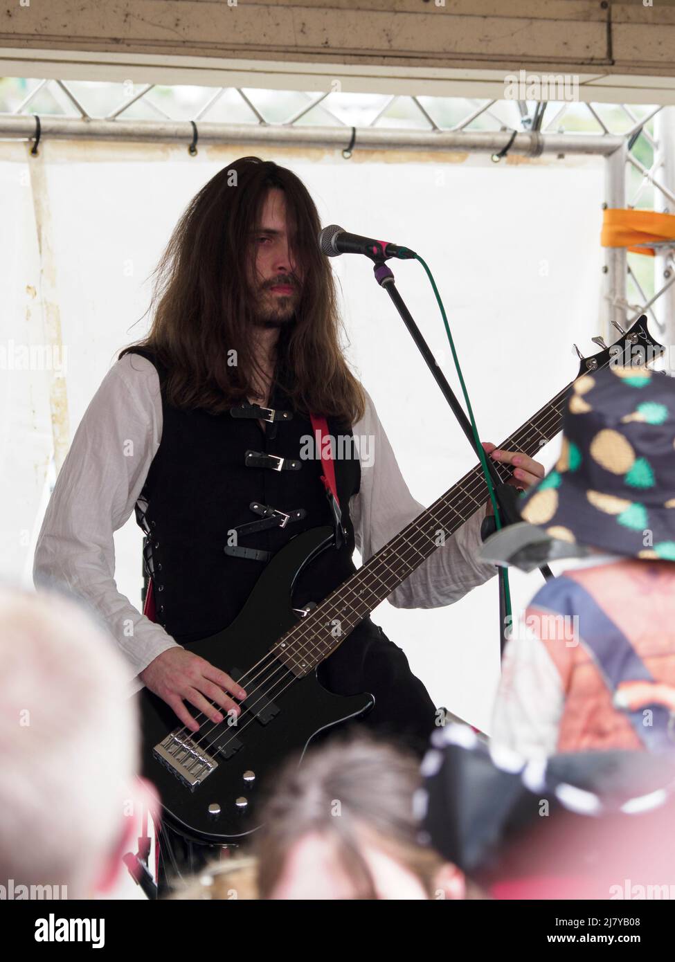 Bass guitarist of The Filthy Spectacula band playing at the Brixham Pirate Festival 2022, Devon, UK Stock Photo