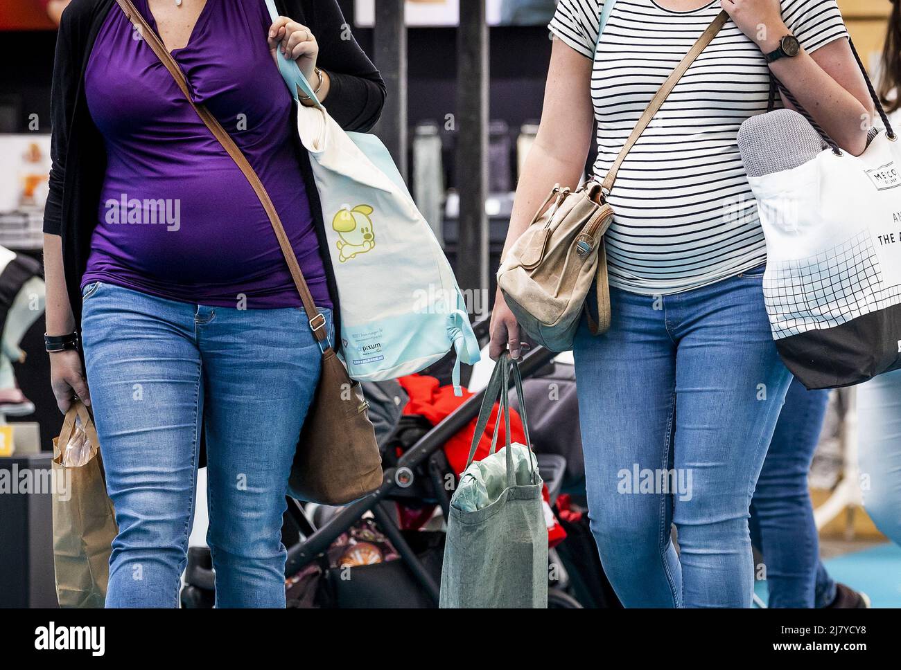 2022-05-11 16:14:16 AMSTERDAM - Visitors on the first day of the Nine Months Fair in the RAI. It is the first time since the outbreak of the corona pandemic that the fair on pregnancy and babies is taking place again. REMKO DE WAAL netherlands out - belgium out Stock Photo