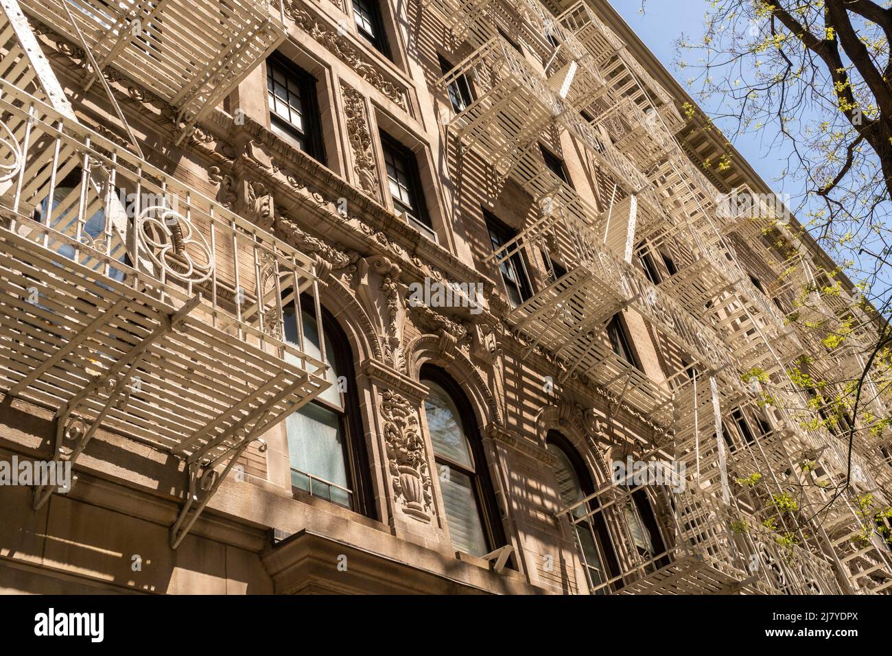 Fire escapes on an occupied multiple dwelling in Greenwich Village in New York on Friday, April 29, 2022. (© Richard B. Levine) Stock Photo