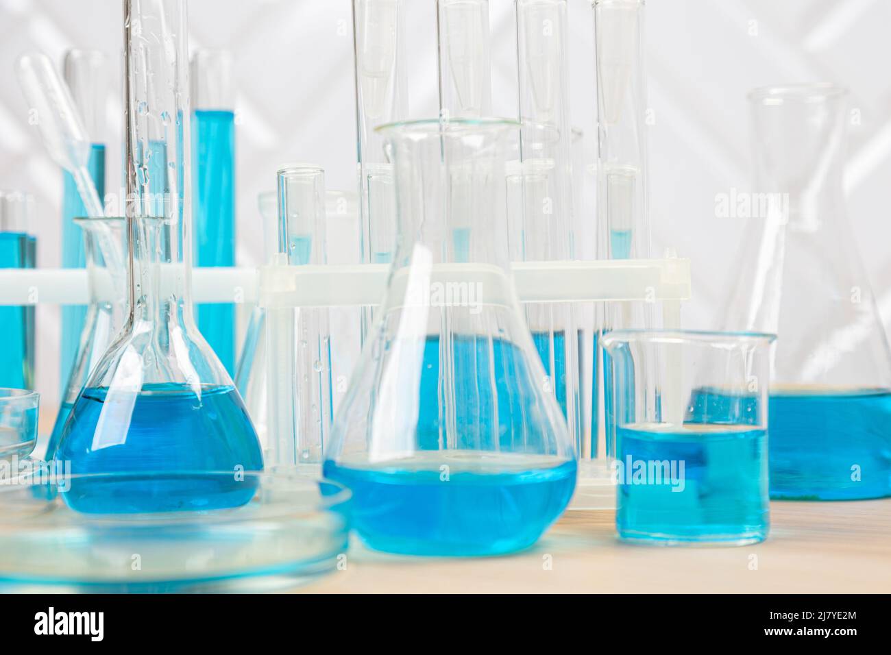 Laboratory glassware with blue liquid in a test tube. scientific