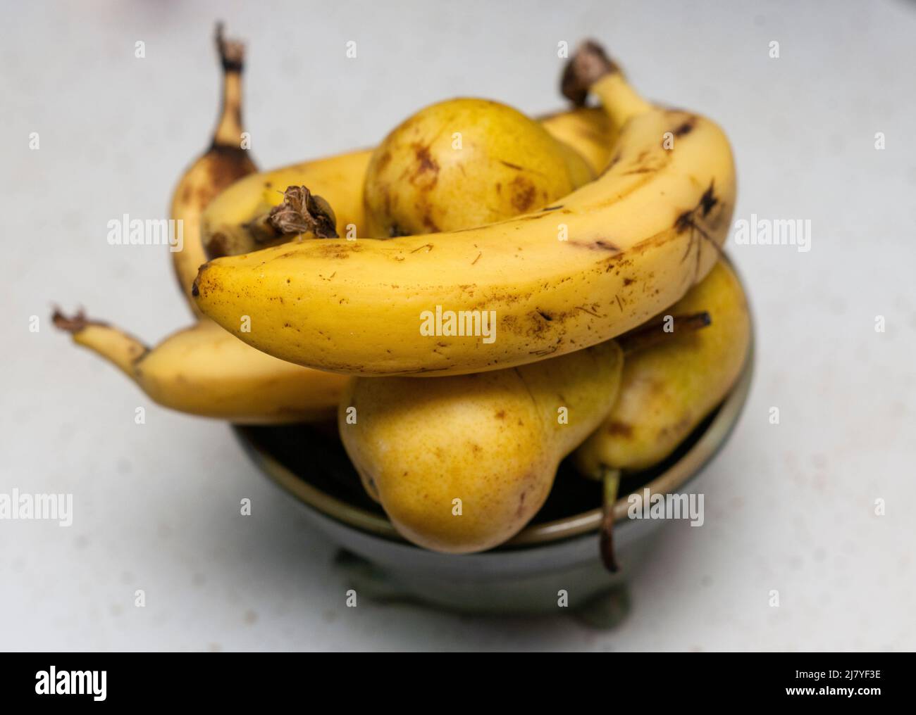 Bartlett pears ripening in a bowl with bananas in New York on Saturday