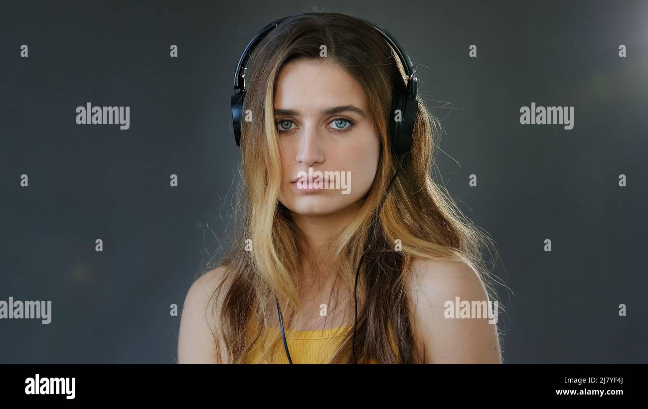 Studio portrait gray background young beautiful serious girl student ...