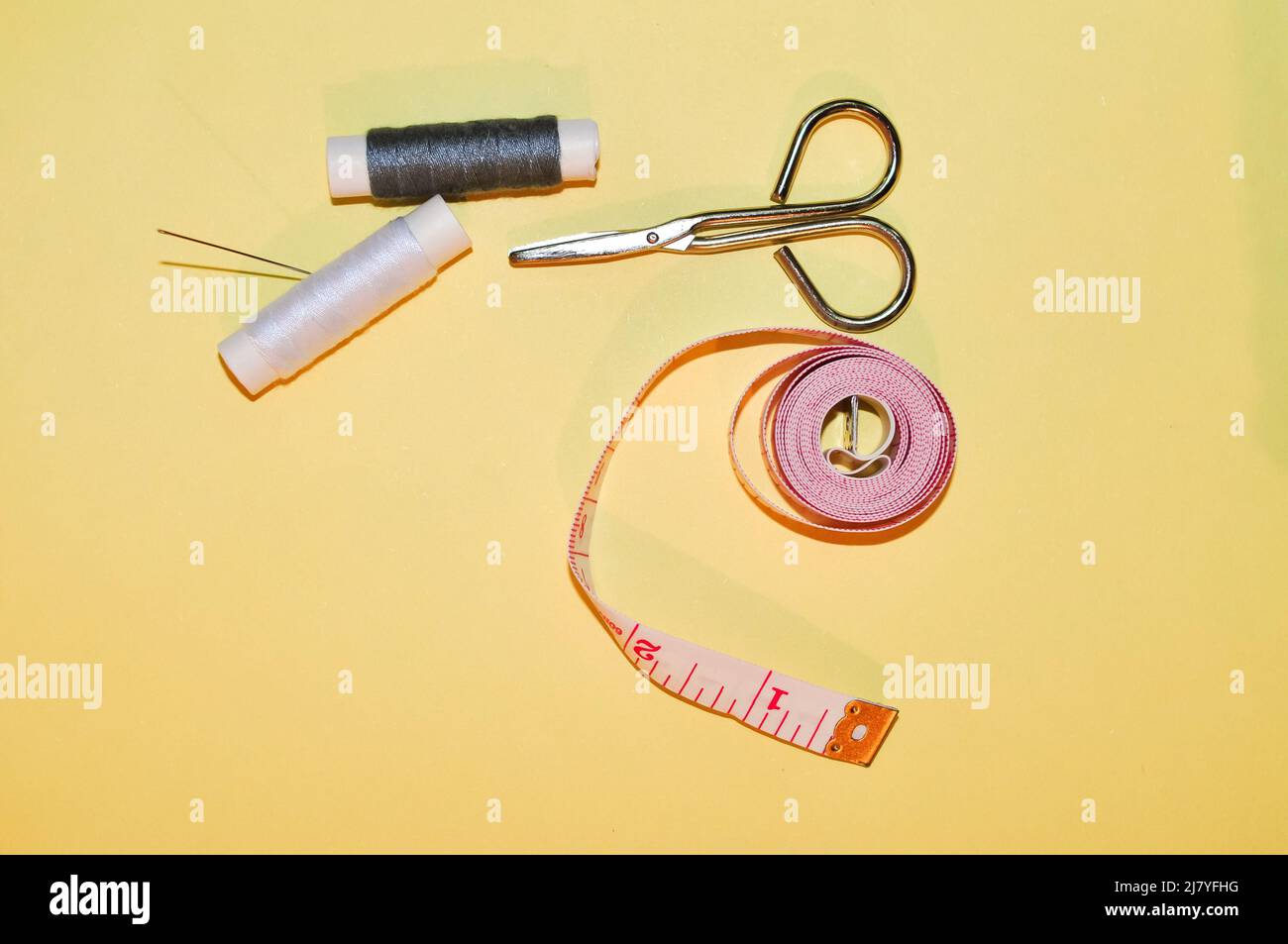 Equipment for sewing scissors tap measure and threads Stock Photo Alamy