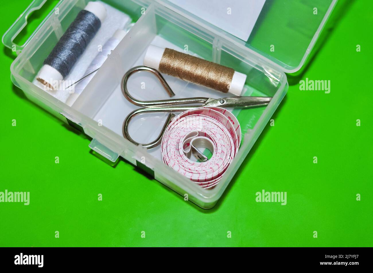 Equipment for sewing scissors tap measure and threads Stock Photo Alamy