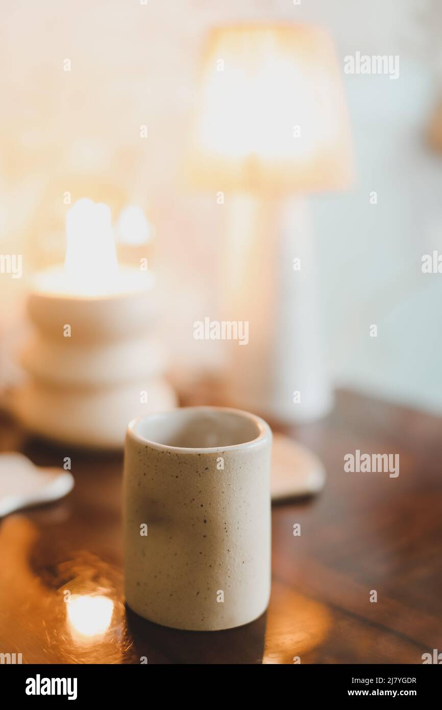 ceramic cup on a cozy warm background indoors.  Stock Photo