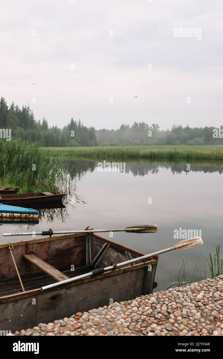 wooden boat by the pier on the lake on nature background Stock Photo ...