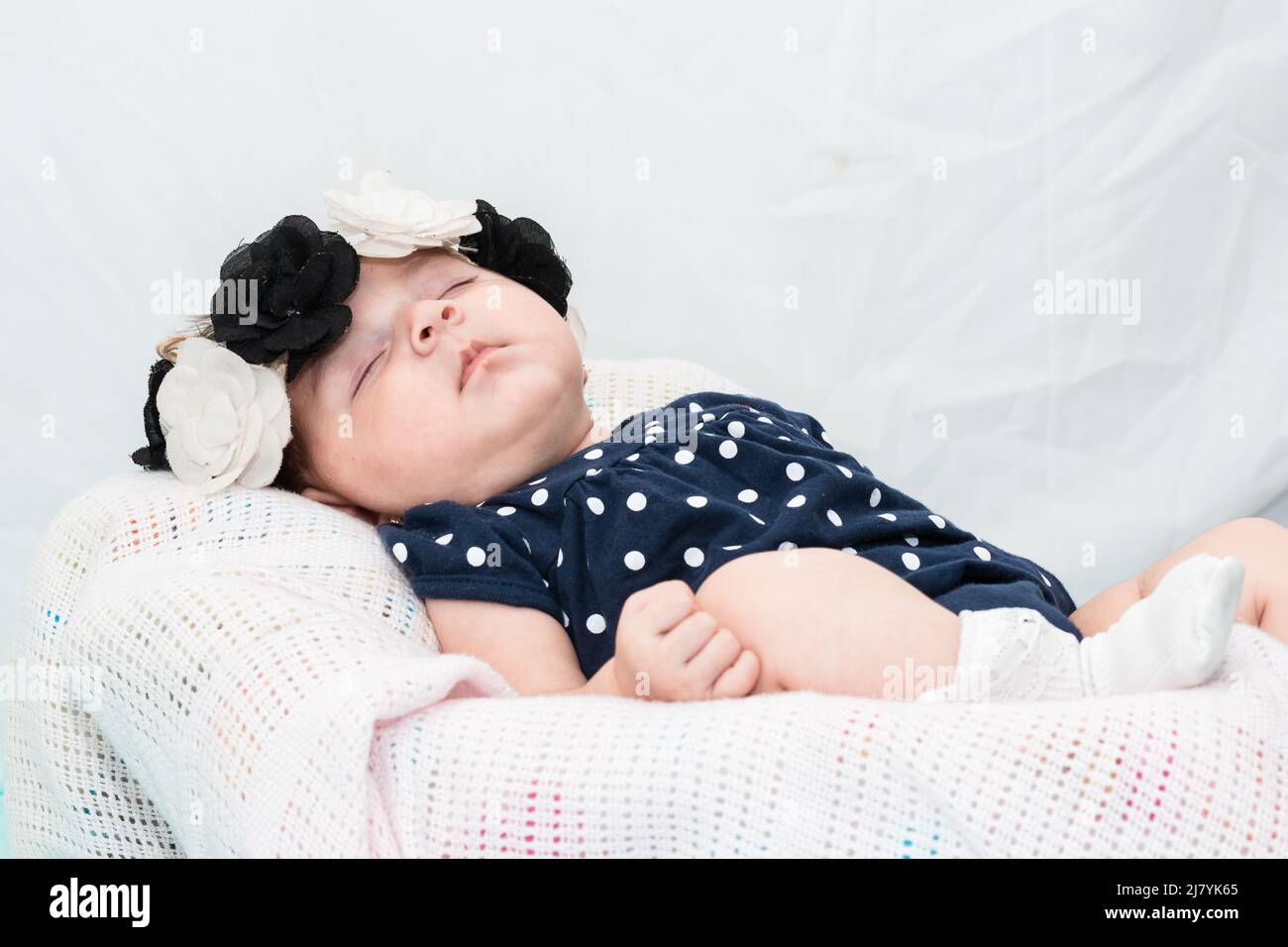 beautiful latina baby girl resting on a 