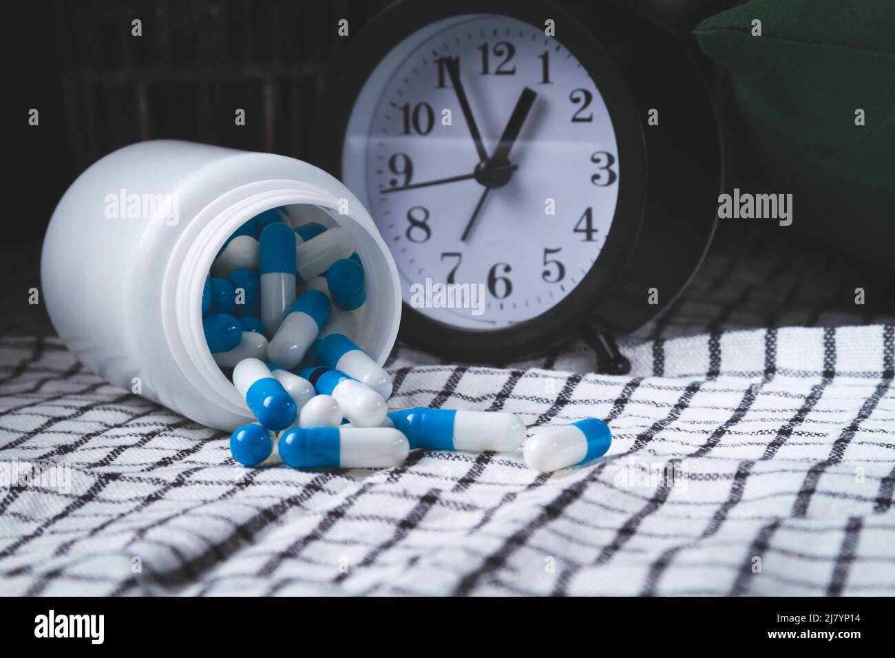 Time to take your medicine. Pill reminder. Tablets and alarm clock