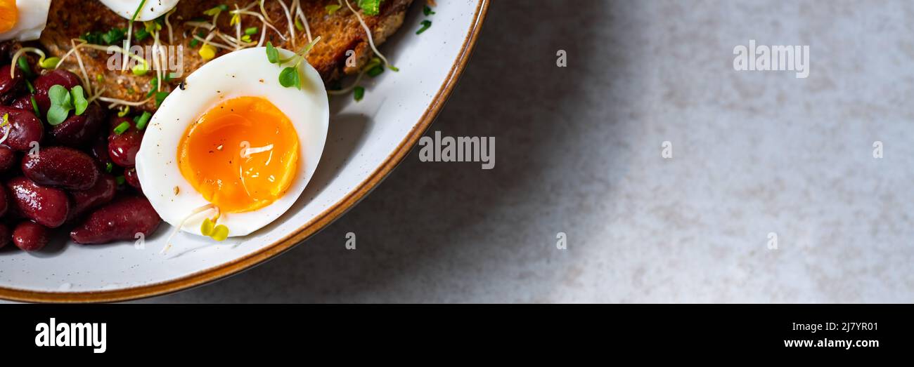 Medium boiled eggs with sasld, healthy breakfast Stock Photo