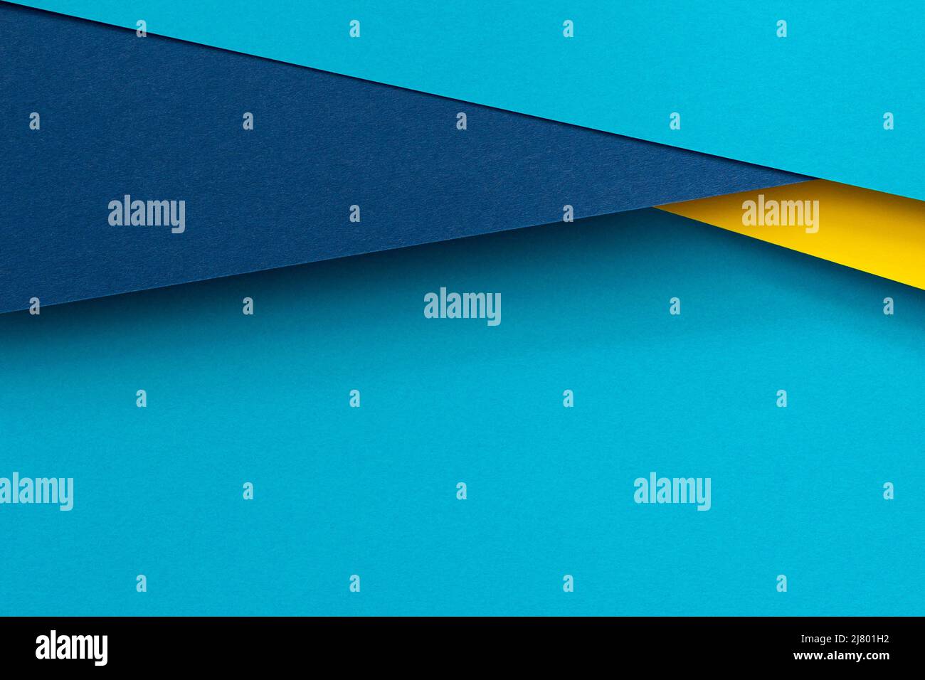Abstract color papers geometry flat lay composition background with blue and yellow tones Stock Photo