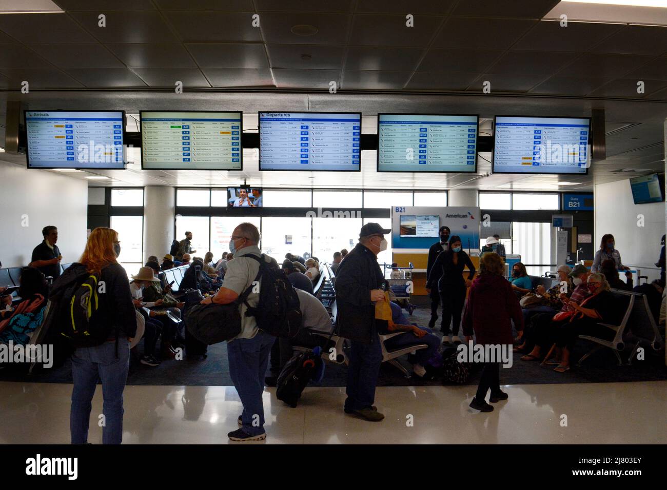 Passengers wait in the terminal before boarding their planes at Phoenix
