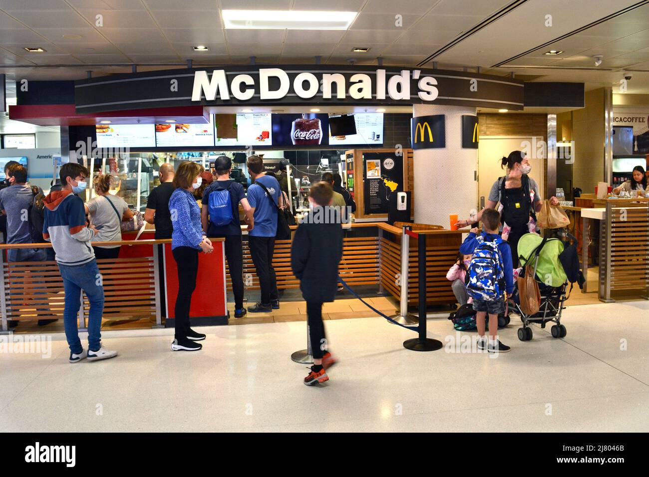 Customers purchase food at a McDonald's fast food restaurant in the