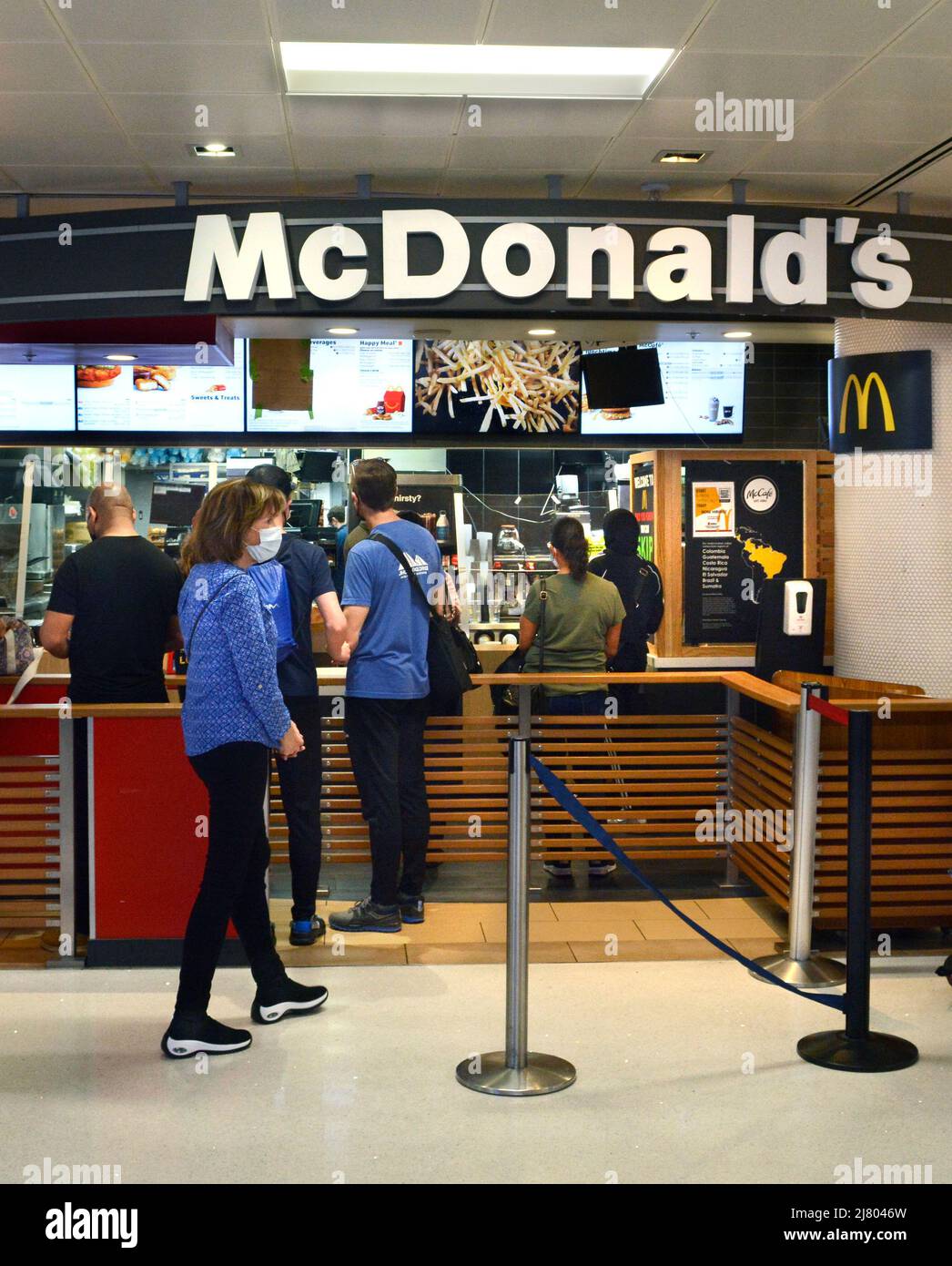 Customers purchase food at a McDonald's fast food restaurant in the terminal at Phoenix Sky Harbor International Airport in Phoenix, Arizona. Stock Photo