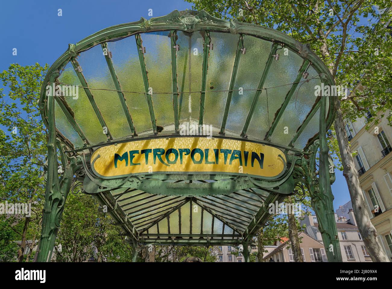 The entrance to the Métro Abbesses station was designed by Hector Guimard, originally located at Hôtel de Ville & moved to place des Abbesses in 1974. Stock Photo