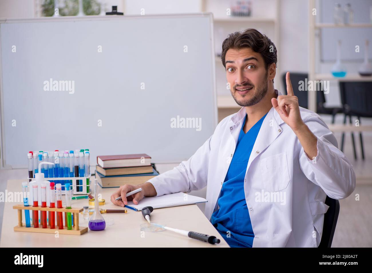 Young chemist working at the lab Stock Photo
