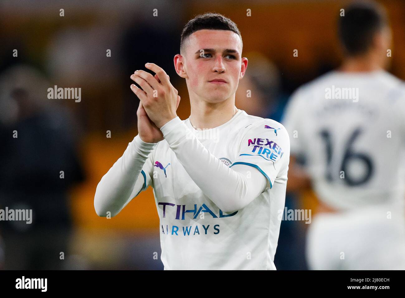 11th May 2022; Molineux Stadium, Wolverhampton, West Midlands, England; Premier League Football, Wolverhampton Wanderers versus Manchester City: Phil Foden of Manchester City applauds the travelling Manchester City fans after the final whistle Stock Photo