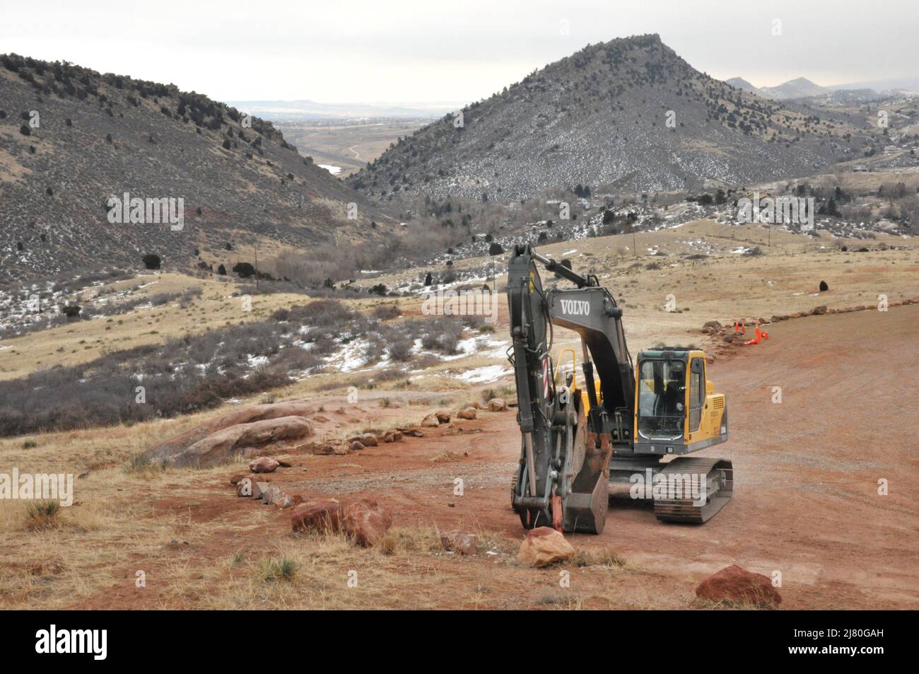 Volvo back hoe for construction in parking lot at Red Rocks Park in Morrison Colorado Stock Photo