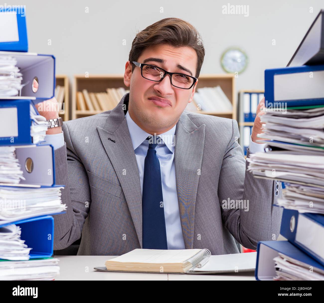 The busy businessman under stress due to excessive work Stock Photo - Alamy