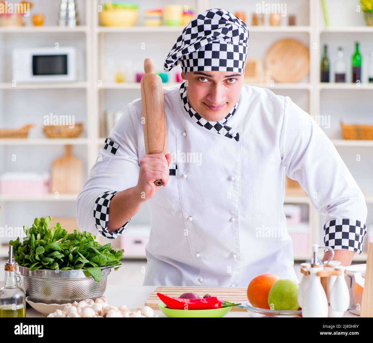 Work About Cook The young male cook working in the kitchen Stock Photo - Alamy