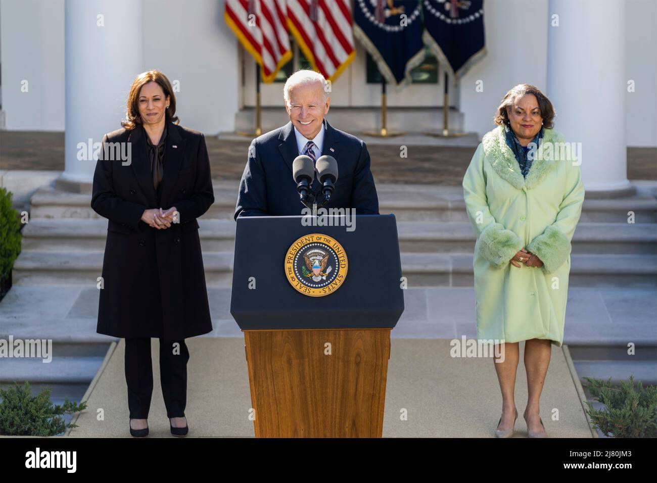 U.S President Joe Biden, delivers remarks as Michelle Duster, great granddaughter of NAACP co-founder Ida B. Wells, right, and Vice President Kamala Harris, right, look on during the signing ceremony for H.R. 55, the Emmett Till Anti-lynching Act, in the Rose Garden of the White House, March 29, 2022 in Washington, D.C. Stock Photo