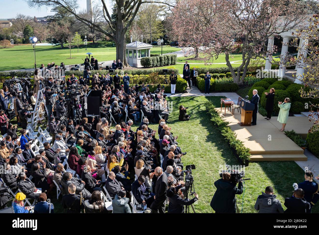 U.S President Joe Biden, delivers remarks as Michelle Duster, great granddaughter of NAACP co-founder Ida B. Wells, right, and Vice President Kamala Harris, right, look on during the signing ceremony for H.R. 55, the Emmett Till Anti-lynching Act, in the Rose Garden of the White House, March 29, 2022 in Washington, D.C. Stock Photo