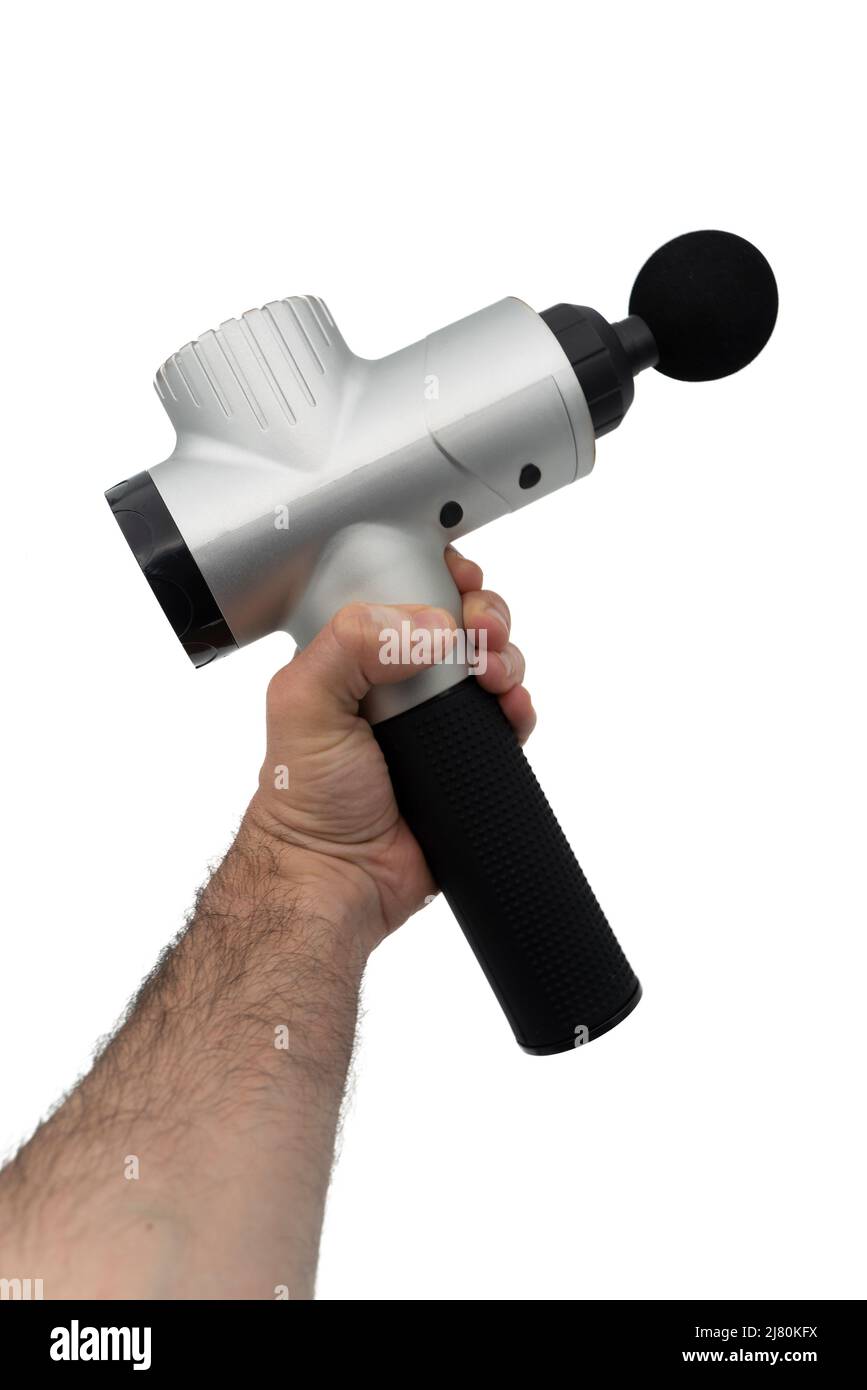 Person holding a massage gun isolated on white background Stock Photo
