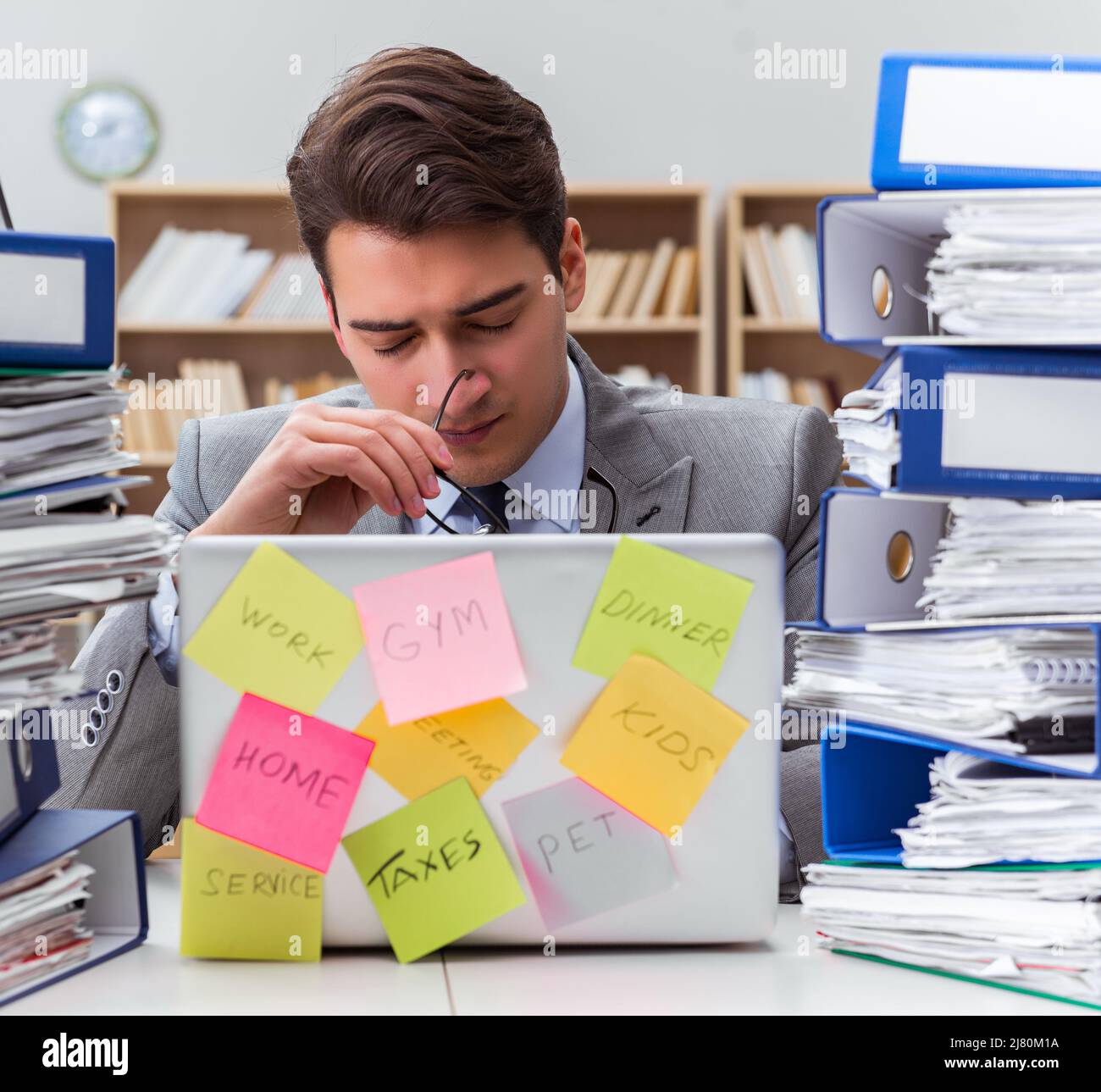Multiple Priorities Image The businessman struggling with multiple priorities Stock Photo - Alamy