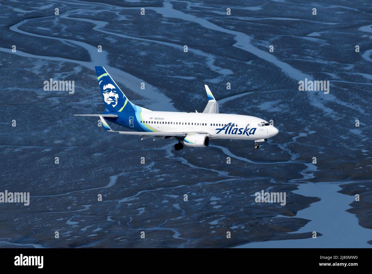 Alaska Airlines Boeing 737 airplane from above. Aircraft of Alaska Airlines aerial view over water. 737-700 plane. Stock Photo
