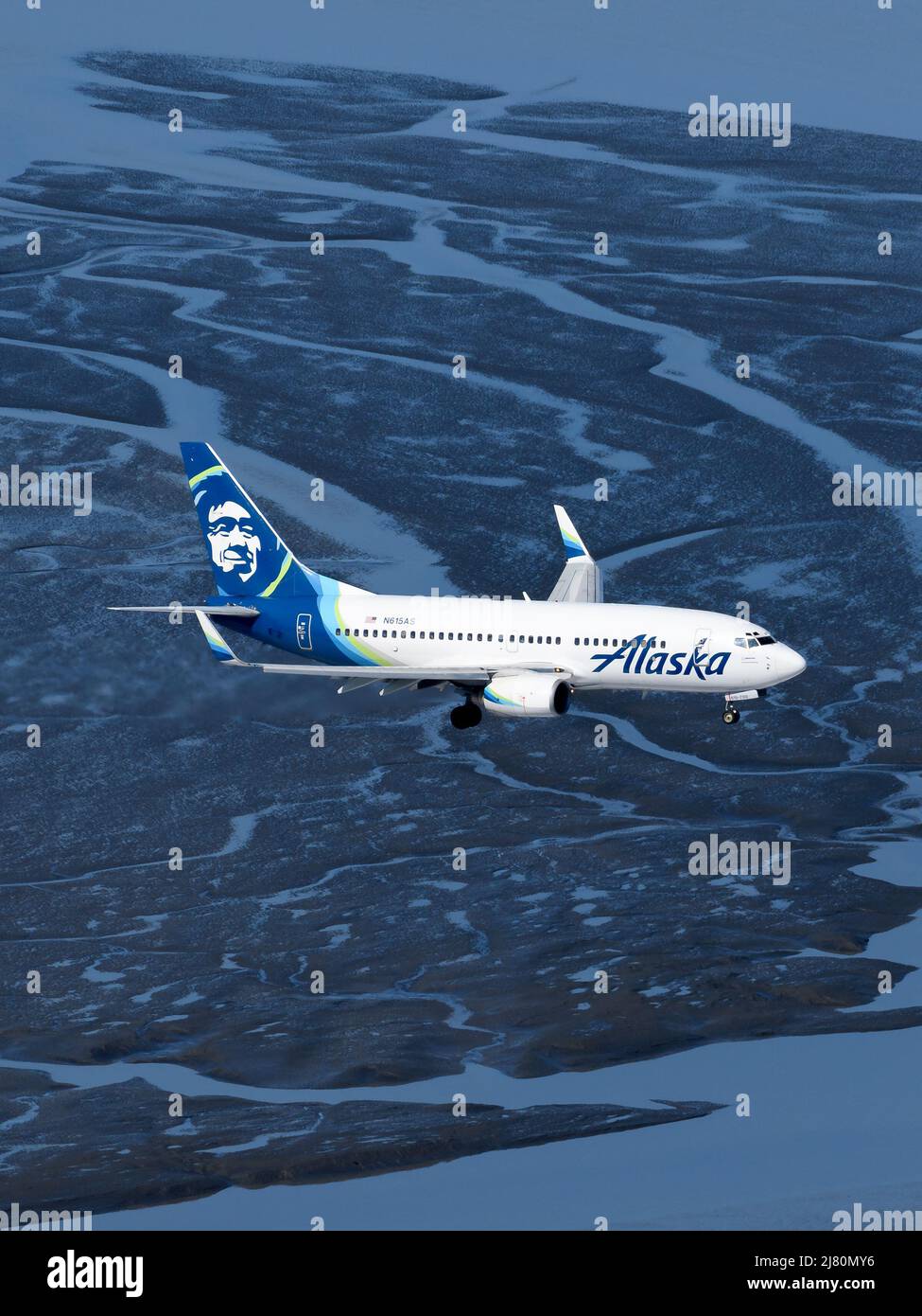 Alaska Airlines Boeing 737 airplane from above. Aircraft of Alaska Airlines aerial view over water. 737-700 plane. Stock Photo