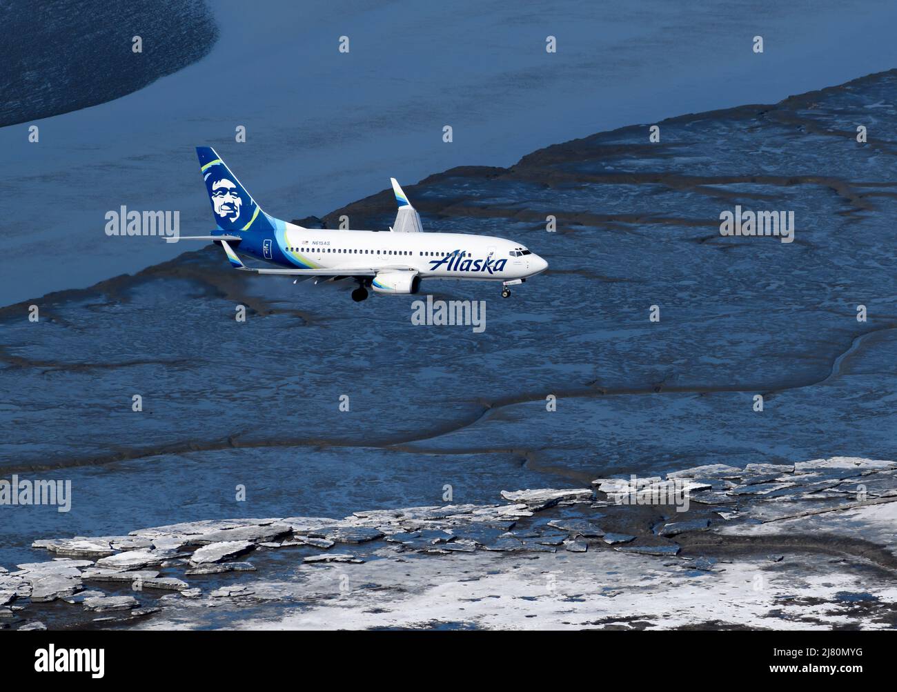 Alaska Airlines Boeing 737 airplane from above. Aircraft of Alaska Airlines aerial view over water. Stock Photo