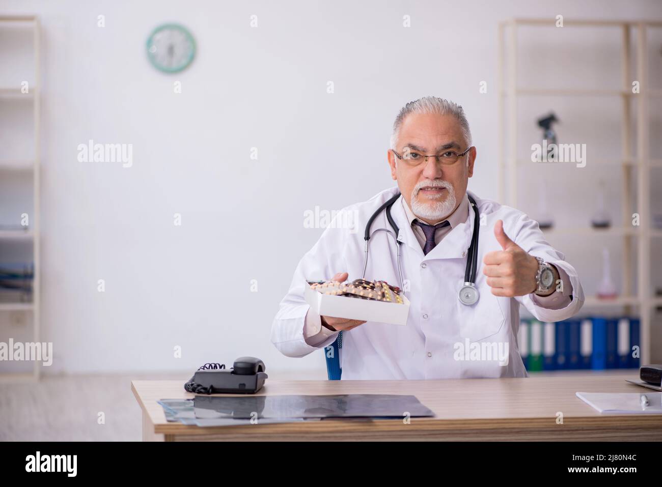 Male doctor giving medicines hi-res stock photography and images - Alamy