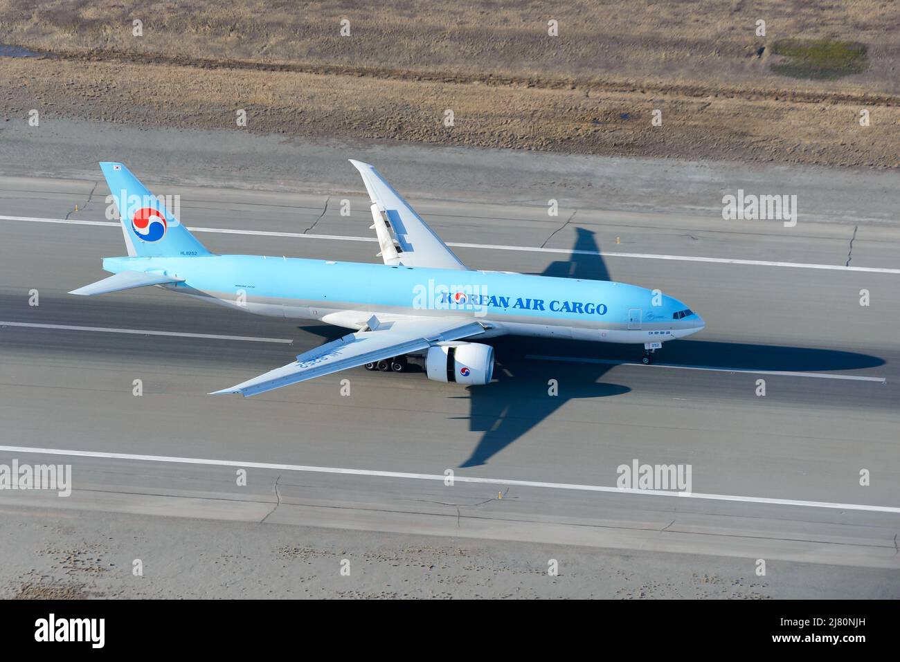 Korean Air Cargo Boeing 777 plane landing. Airplane 777 cargo. Freighter aircraft of KoreanAir Cargo landing. Stock Photo