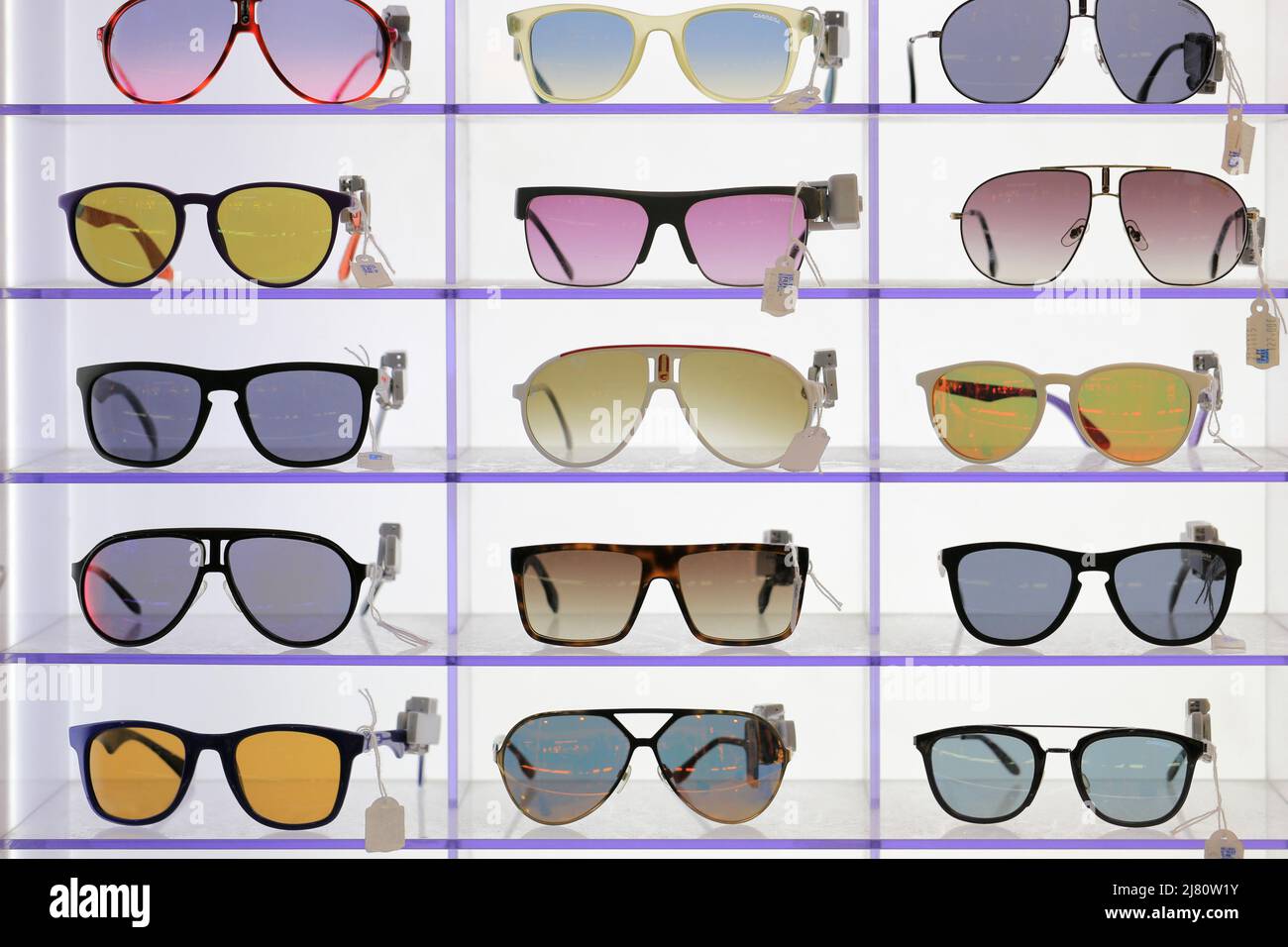 Sunglasses on the shelf of an optics store Stock Photo