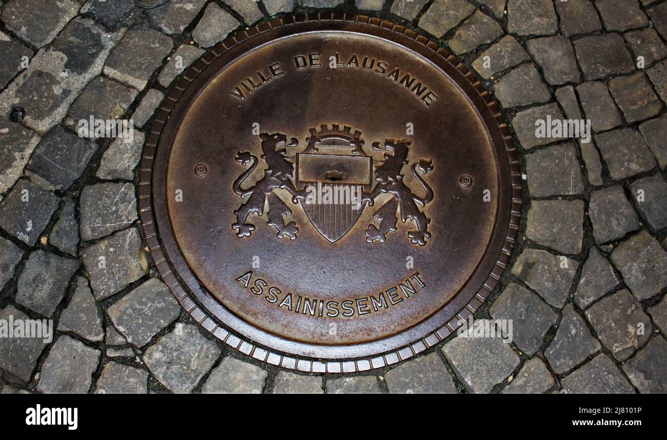 Circular metal man hole cover in lausanne Stock Photo