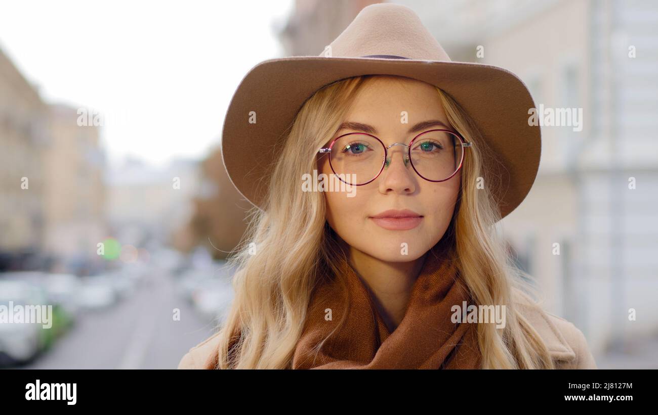 Portrait positive young woman with natural makeup attractive caucasian millennial pretty girl looking at camera close-up female with long blond hair Stock Photo
