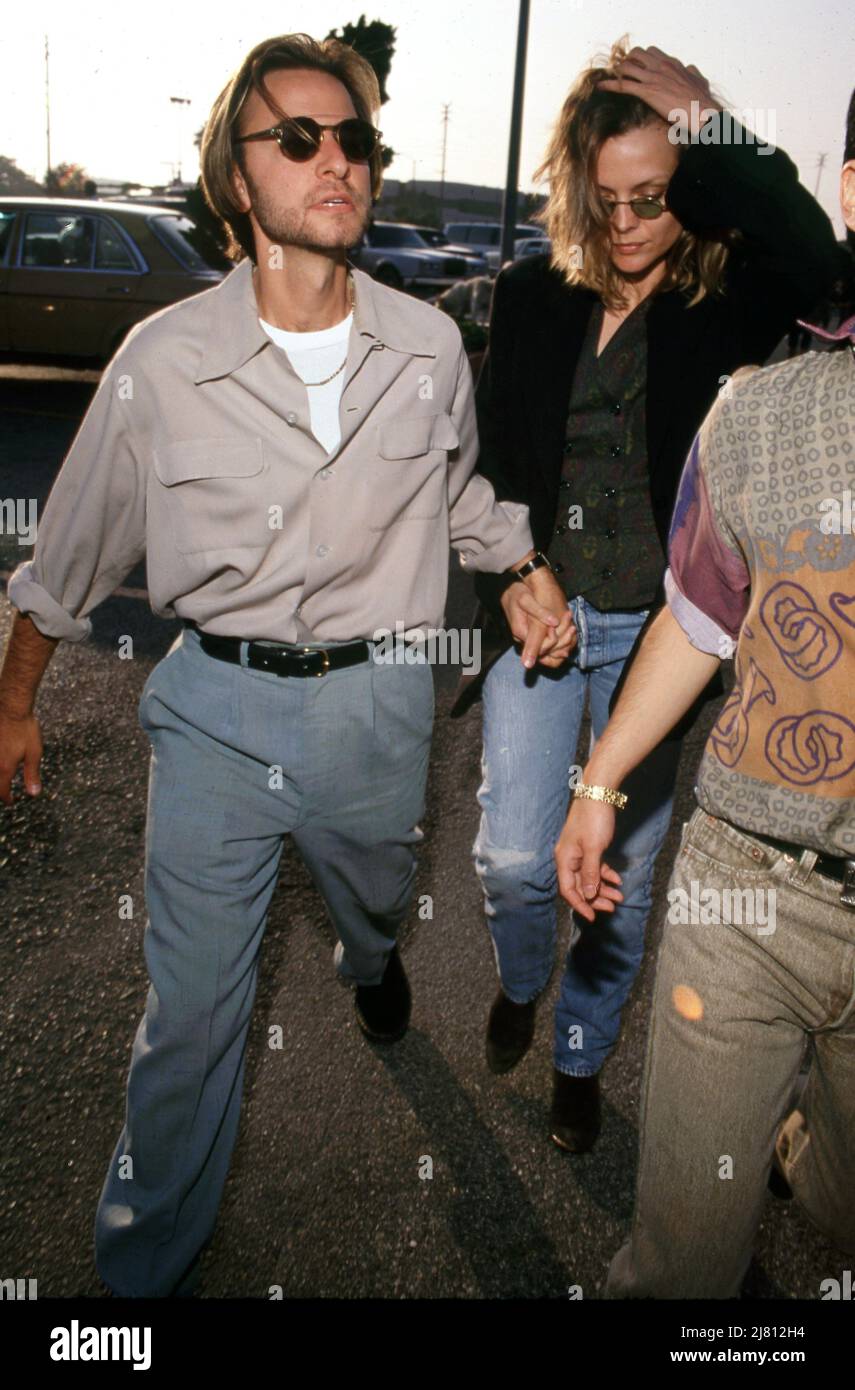 Michelle Pfeiffer and Fisher Stevens Circa 1990's. Credit: Ralph  Dominguez/MediaPunch Stock Photo - Alamy, image size:855x1390